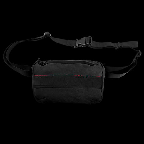 The Condor Tech Pouch is a black crossbody sling bag with an adjustable strap, front zipper pocket, and subtle red stitching—perfect for carrying law enforcement or shooting range essentials.